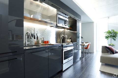 Apartments in Portland OR - Yard - Kitchen with Stainless Steel Appliances and Glass Style Cabinets